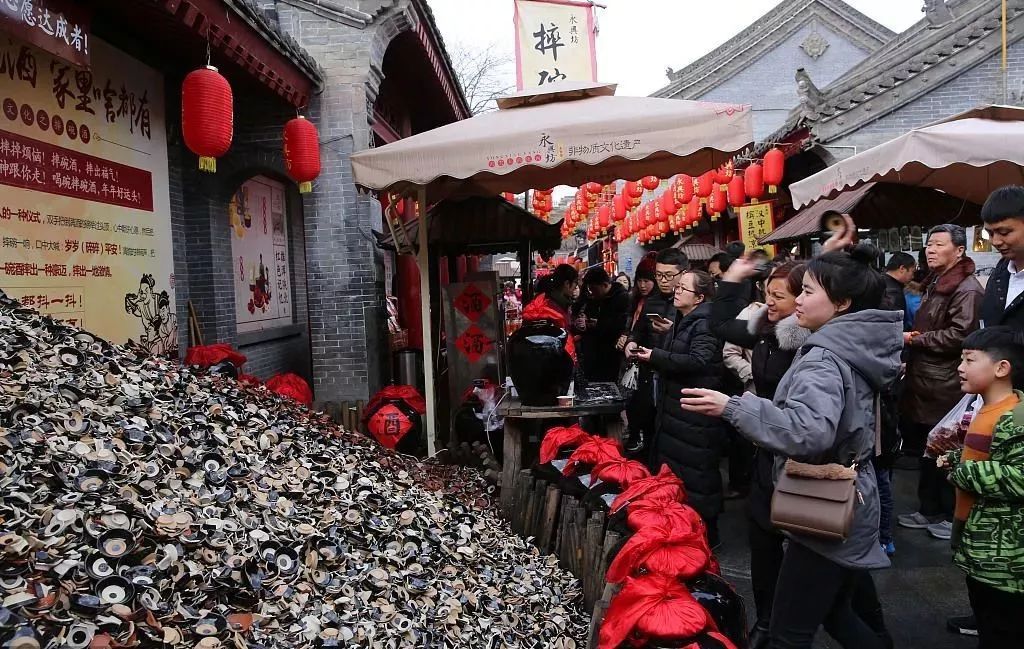 西安摔碗酒的地址在哪里，西安城墻腳下的永興坊